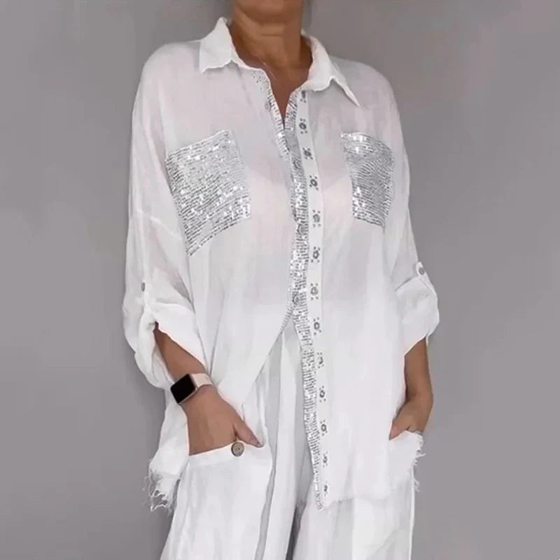 Conjunto de mujer con blusa fluida y pantalón con lentejuelas
