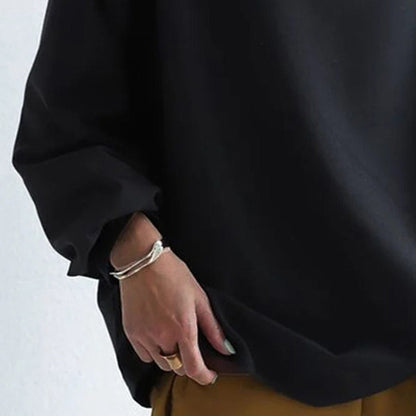 Top de punto para mujer con cuello alto y hombros caídos